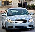 General Motors Chairman and CEO Rick Wagoner arrives for a Senate hearing driving a test version of the Chevrolet Volt extended-range electric vehicle.